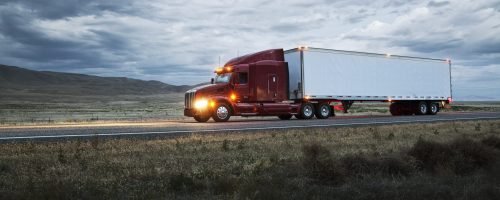 truck on a highway through the grasslands area of eastern Washington, USA.